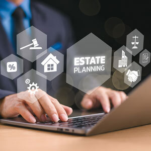 Attorney typing on laptop with estate planning icons overlay, symbolizing advanced estate strategies.